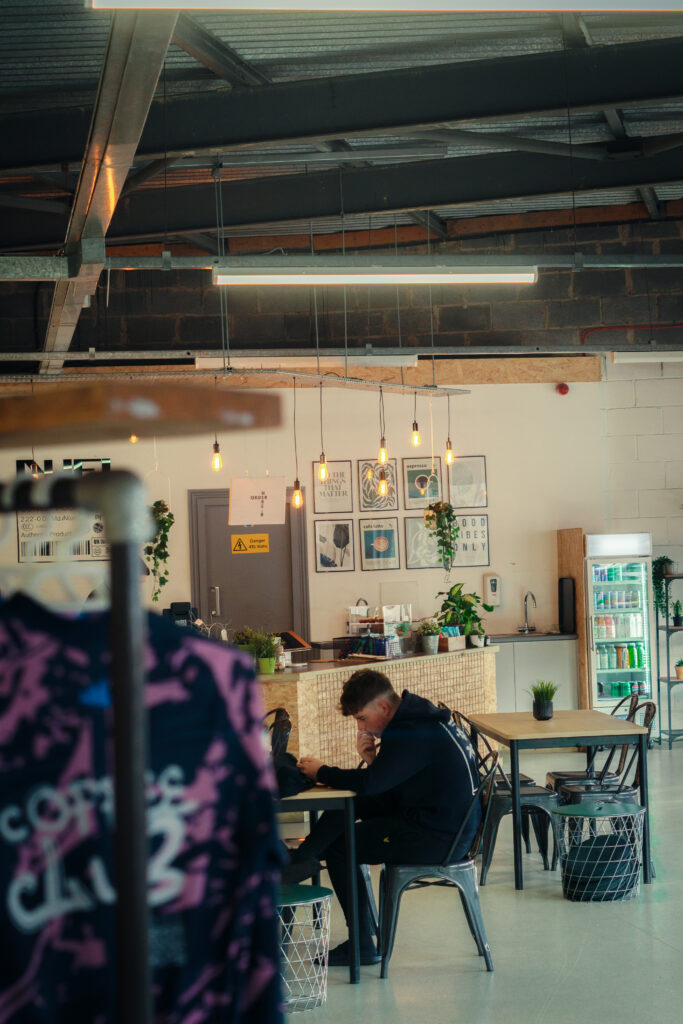 Customers working and relaxing in the warm ambiance of Fuel Coffee Shop.